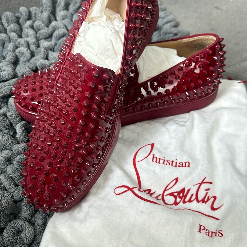 Burgundy spiked Christian Louboutin men’s loafer.